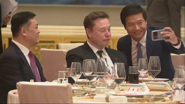 Elon Musk pulls strange faces while taking selfies on China trip