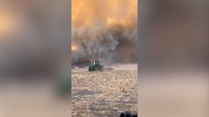 US farmers flee wildfire sparked by dry conditions in dramatic footage