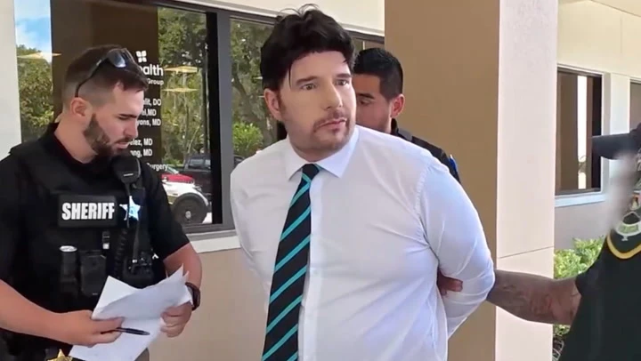 Moment fake nurse is arrested after police lure him to job interview