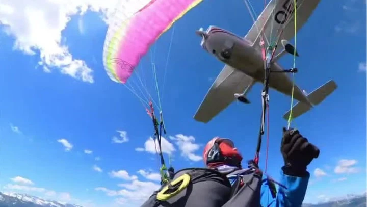 Plane crashes into paraglider and sends her spiraling through the air