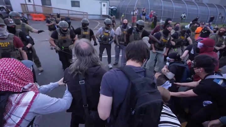 Anti-ICE protesters and federal agents clash outside detention center