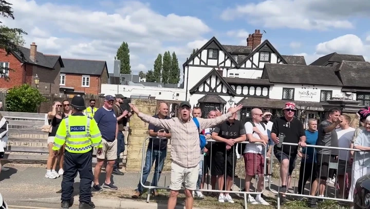 Anti-migrant protesters hurl abuse as rival groups clash in Horley