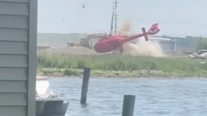 Watch: Helicopter flips and crash lands outside Michigan restaurant