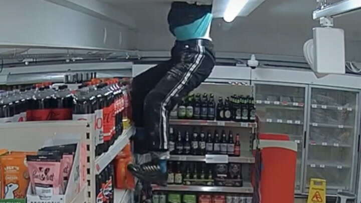 CCTV shows man climbing through Sainsbury’s ceiling to steal crisps