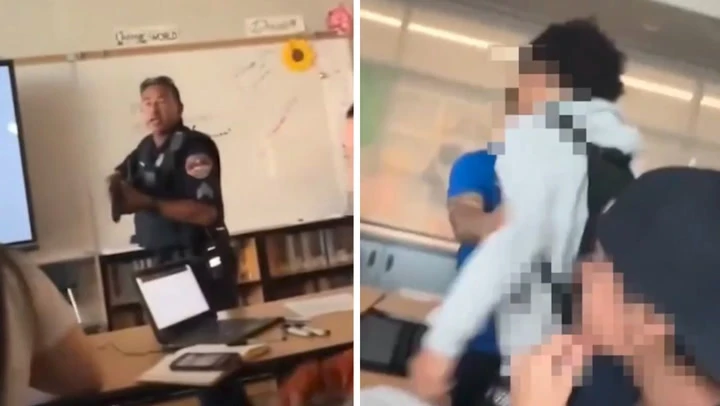 Moment armed police burst into classroom to arrest student over gun
