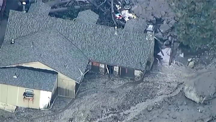 Mudslide buries houses and cars after heavy rain in California