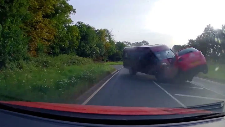 Moment wrong-way minibus driver smashes head-on into car