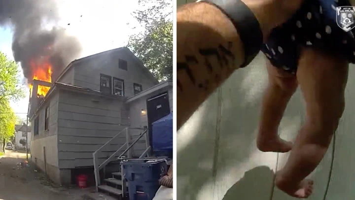 Baby thrown from window of burning home saved by police officer