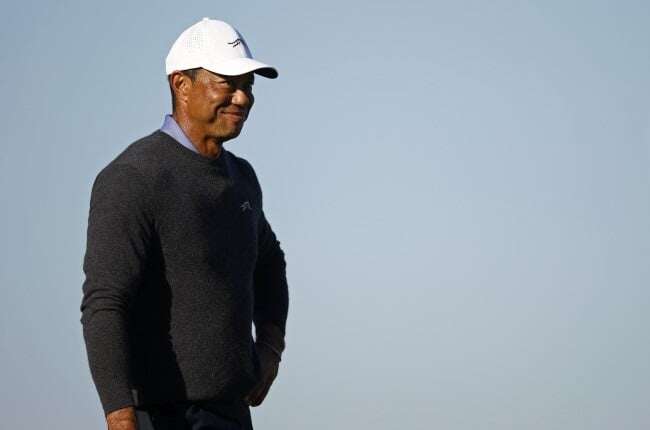 Tiger in family golf event but has 'long way' before PGA return