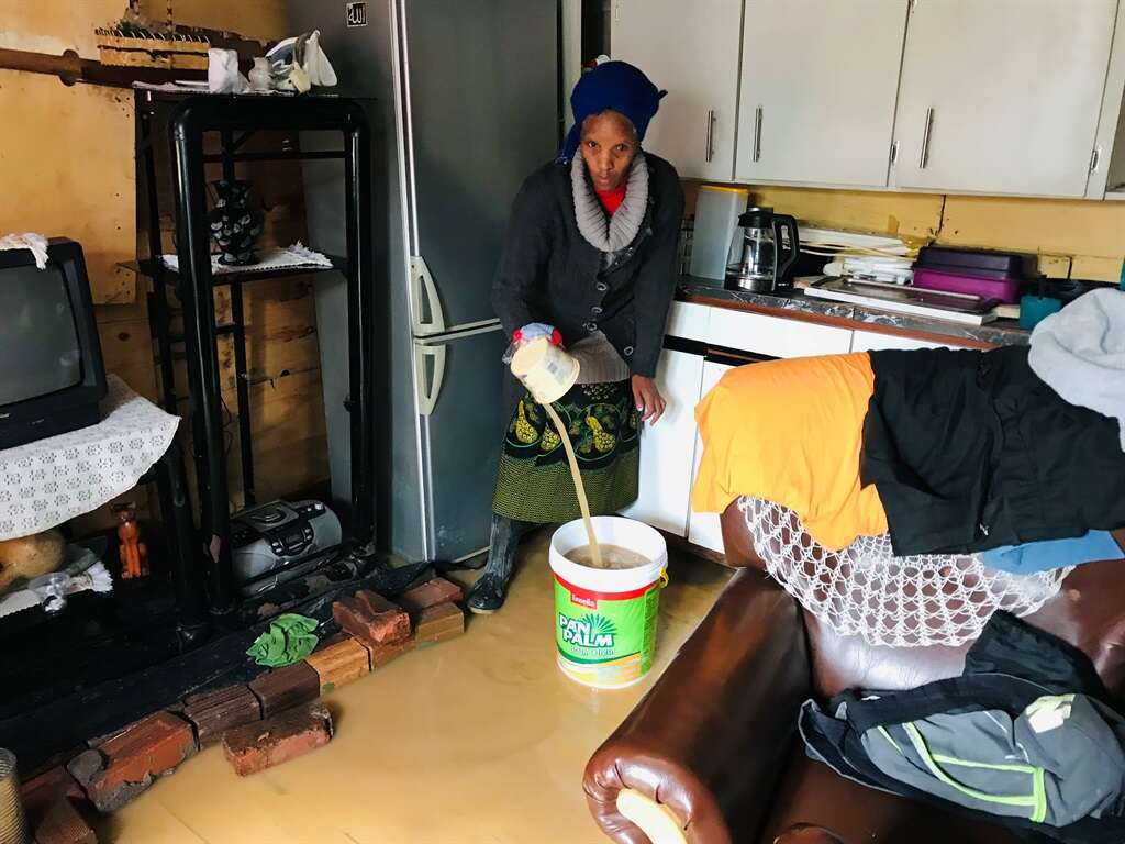 'The water is dirty': Sleepless Cape Town residents struggle to get water out of shacks after flooding