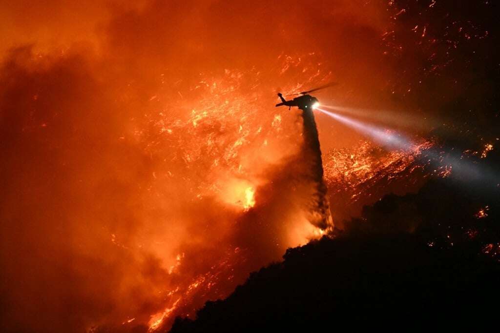 Firefighters race to beat LA blazes as winds grow and death toll hits 16