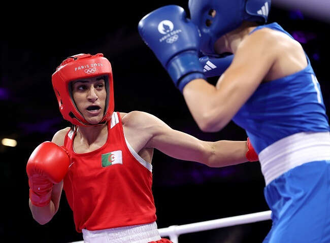 Algerian Olympic boxer in gender row advances after opponent retires after 46 secs