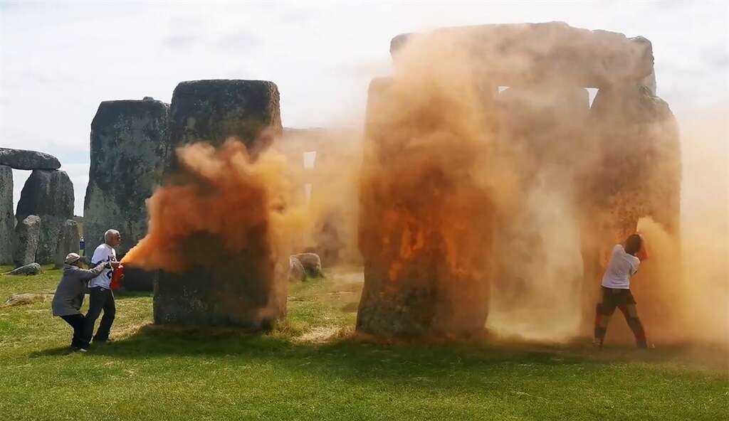 Stonehenge monument sprayed orange in UK climate protest, two arrested