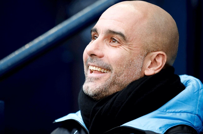 Man City boss Guardiola signs new contract