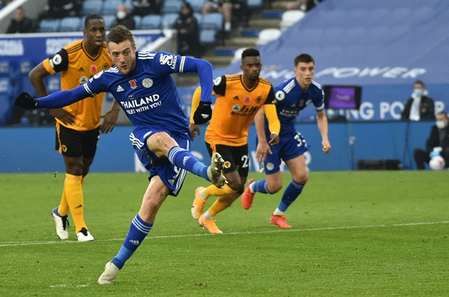 Leicester go top as Jamie Vardy tames Wolves