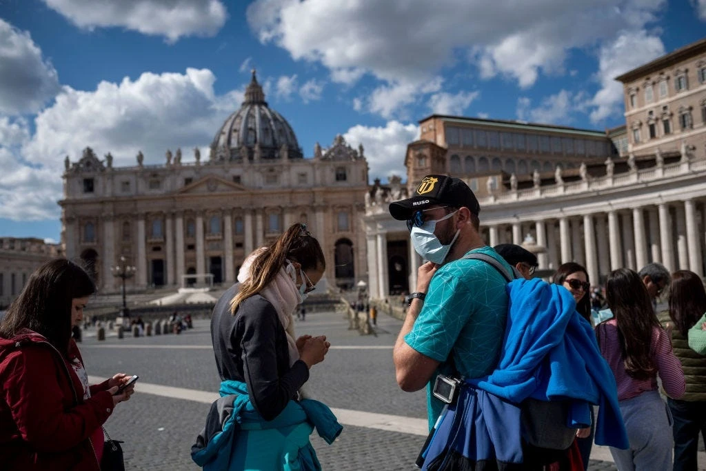 Pope wears mask for first time at public service