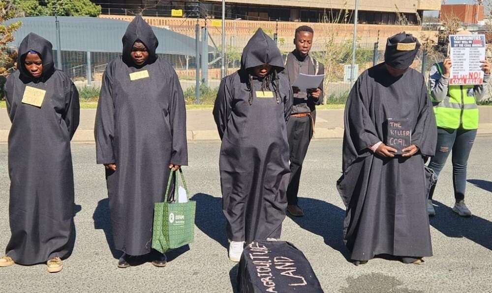 Protesters march with coffin in Sandton against proposed coal mines