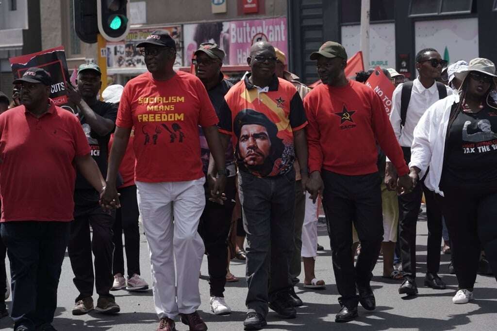 'Crisis of capitalism': Trade unions and lobby groups march to Parliament over proposed tax hikes