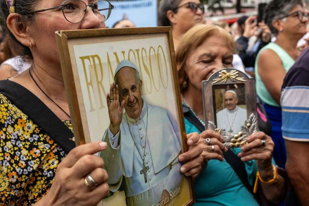 Ailing pope works on saints from hospital as Catholics pray for recovery