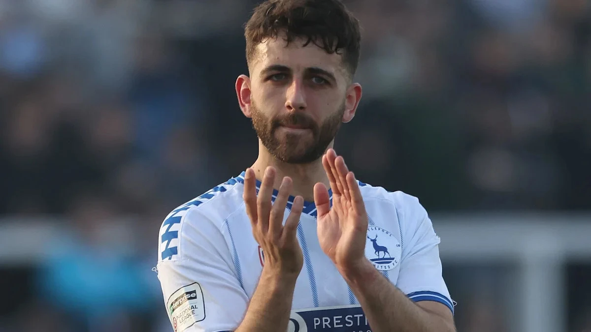 Pools midfielder Hunter extends stay