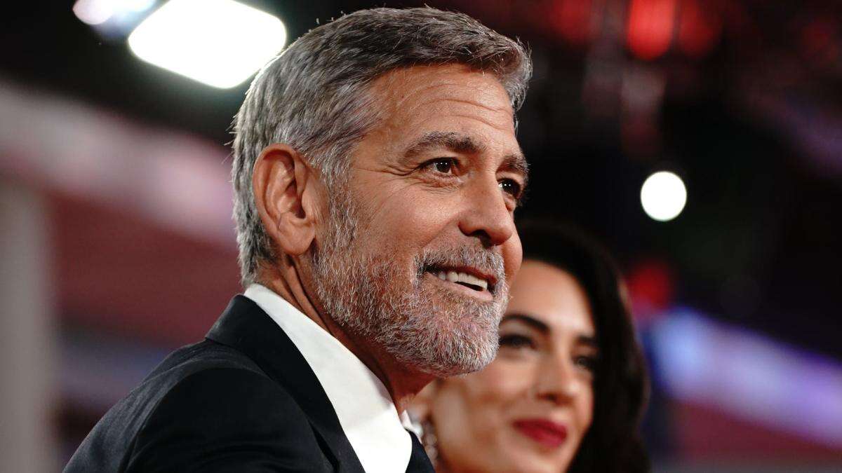 George Clooney plays photographer at star-studded charity event