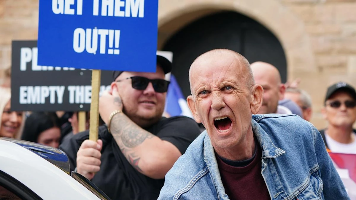 Opposing sides chant and shout outside asylum hotel in Perth