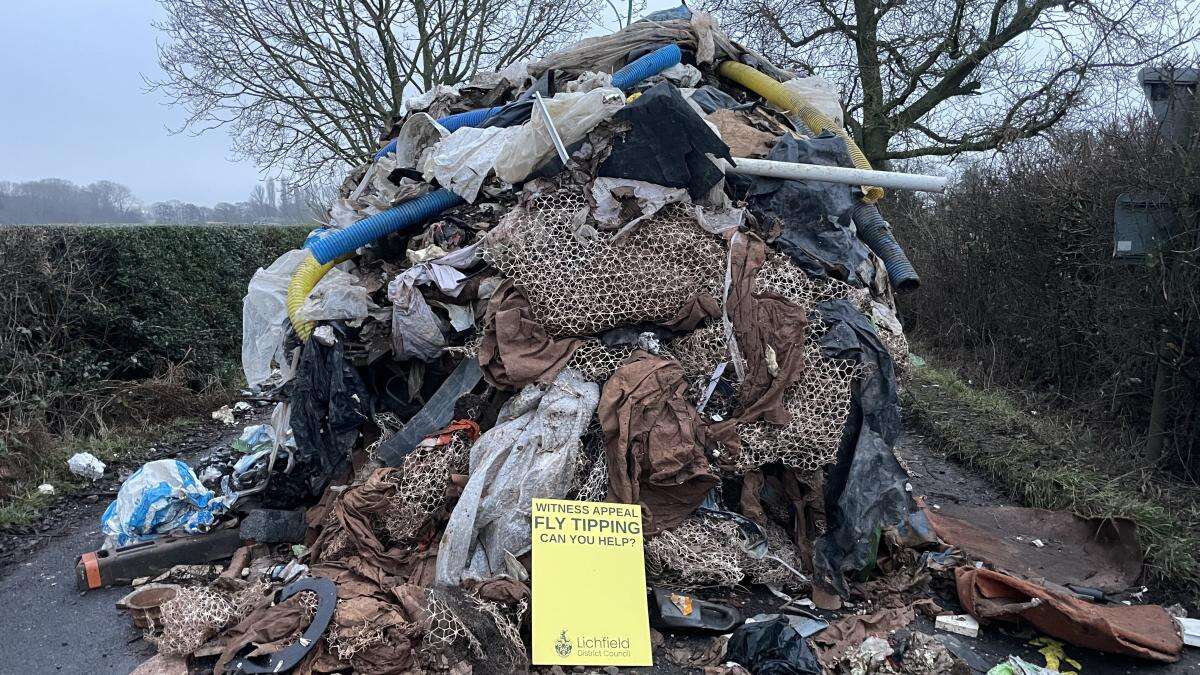 Two tipper trucks believed to be involved in fly-tipping 10ft-high waste mound