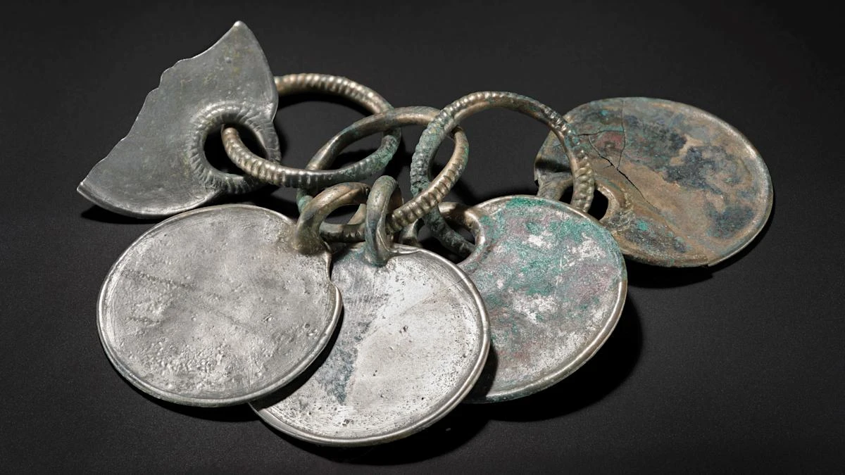 Museum staff describe ‘magical’ moment hoard’s silver colour was revealed