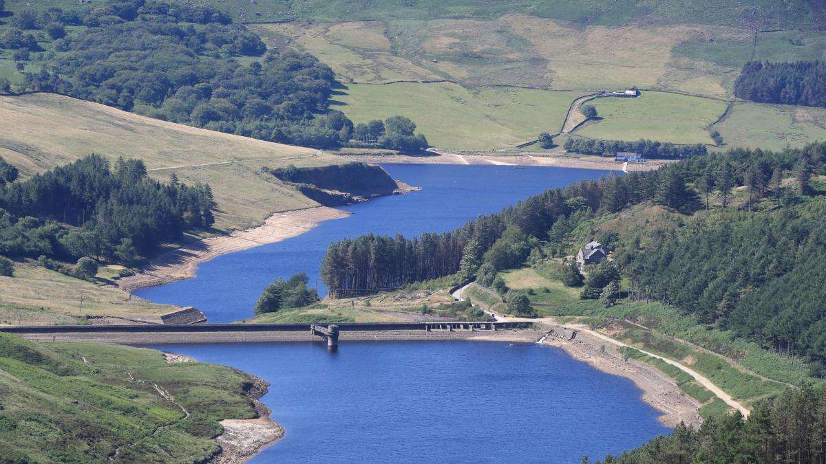 Divers search overnight for man who went into reservoir