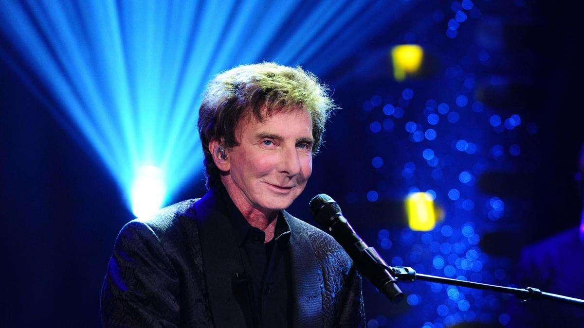 Barry Manilow’s 1.5 million-dollar bonus claim should be heard in US, court told