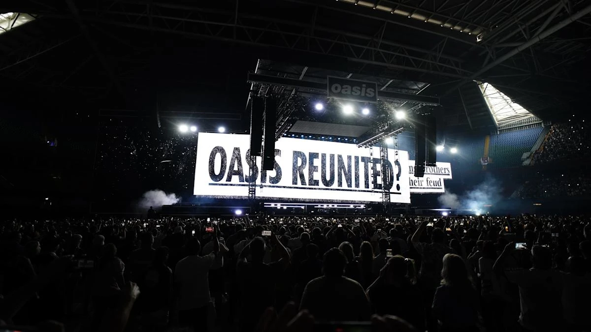 Oasis take to stage for first gig in 16 years to jumping crowd and flying cups