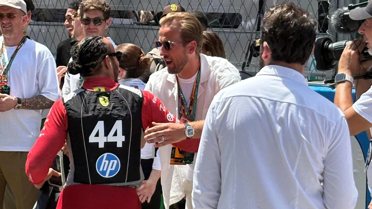 Harry Kane greets Lewis Hamilton as England players take in Spanish Grand Prix