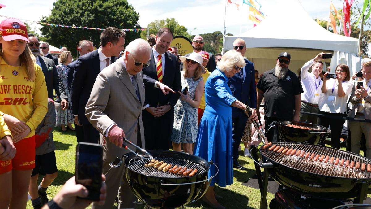 Charles and Camilla take charge of the tongs at Sydney ‘sausage sizzle’ barbeque