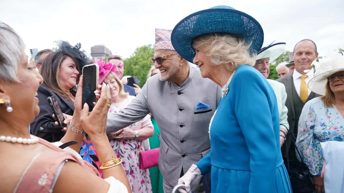 Camilla makes friends with ‘attention-seeking’ guide dog at palace garden party