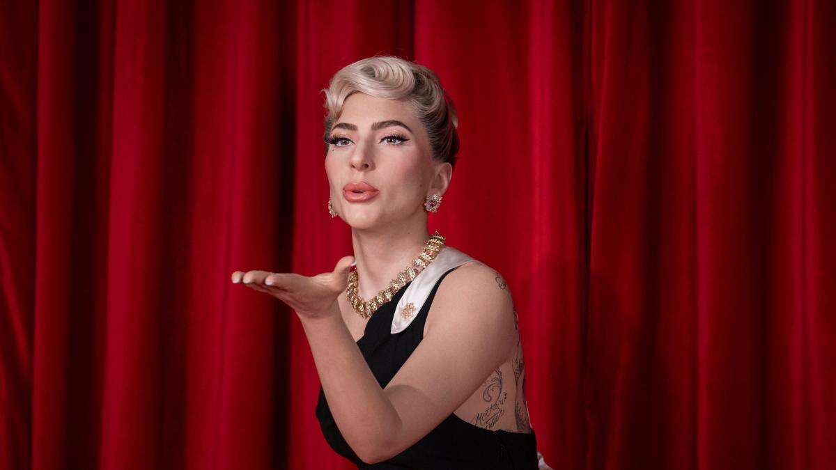 Lady Gaga blows kiss and wears black gown in waxwork unveiled at Madame Tussauds