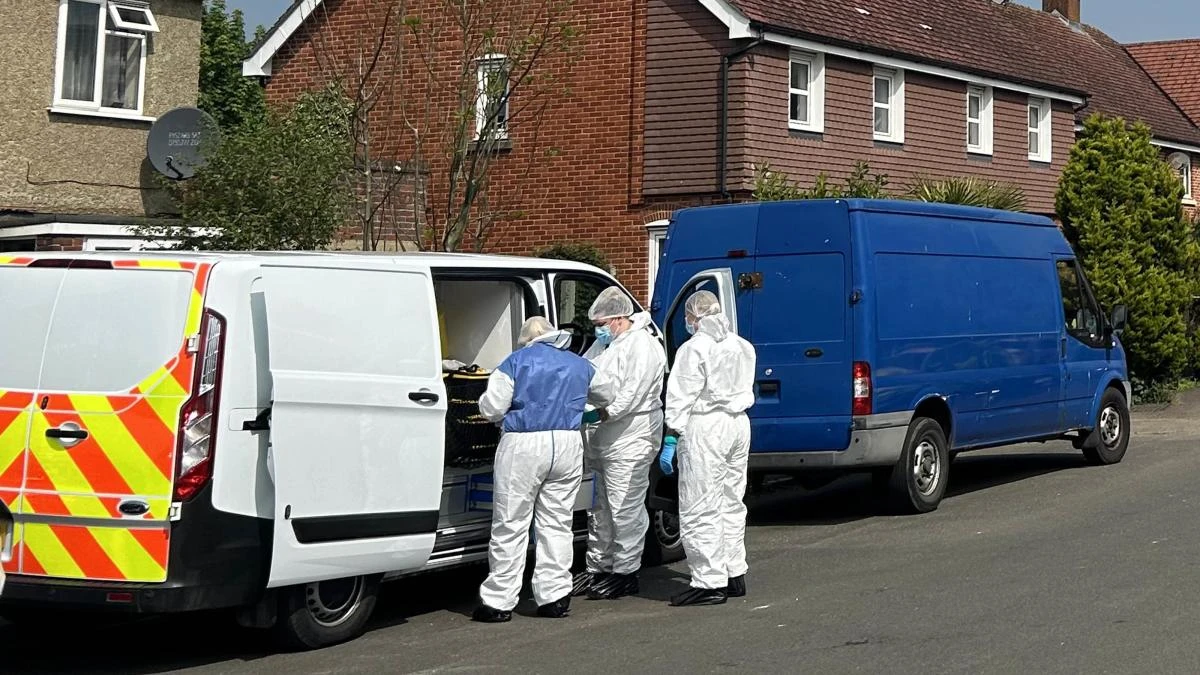 Man held after police officer shot with crossbow following reports of stabbing