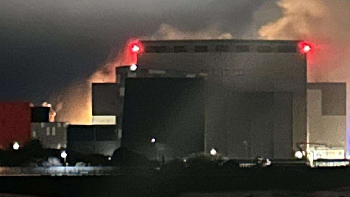 Thick smoke and bright flashes seen during fire at nuclear submarine shipyard