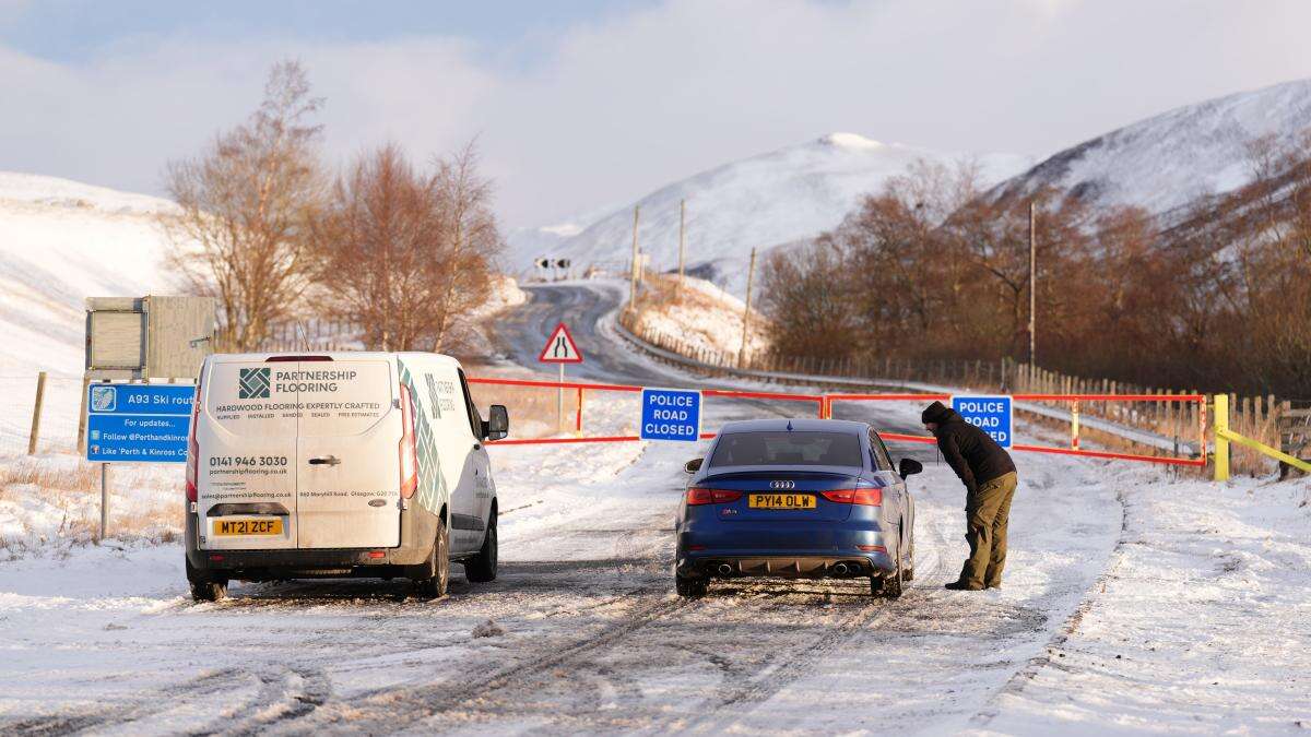 Flights disrupted and schools closed for second day as wintry weather continues