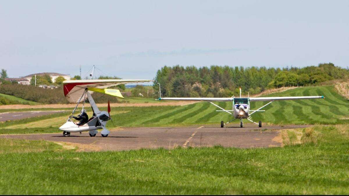 Emergency services at scene after light aircraft crashes near airport