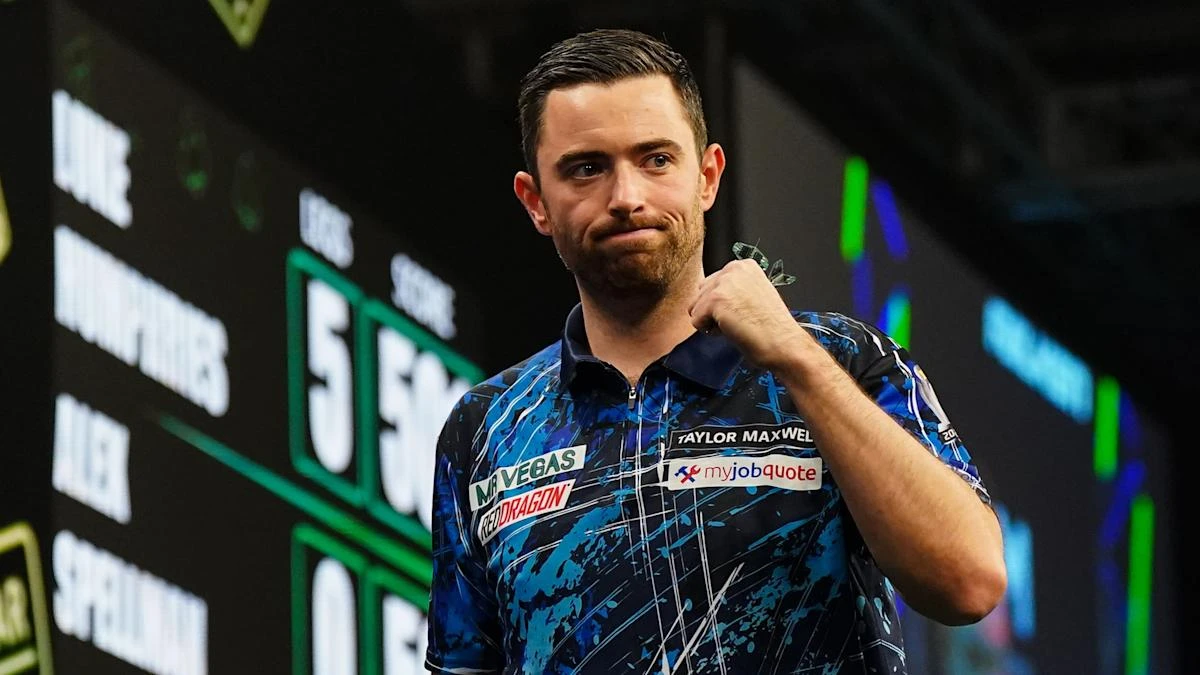 Luke Humphries hits nine-darter to beat Michael Smith at Grand Slam of Darts