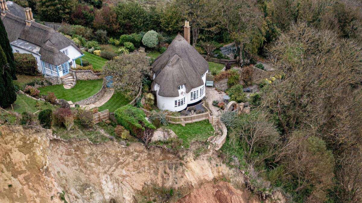 Cottage left teetering on cliff edge following massive landslip