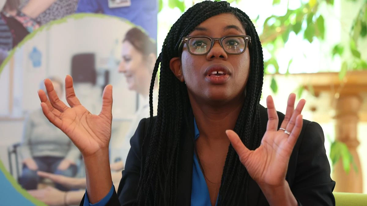 Tory leader Kemi Badenoch speaks with patients and staff on visit to hospice