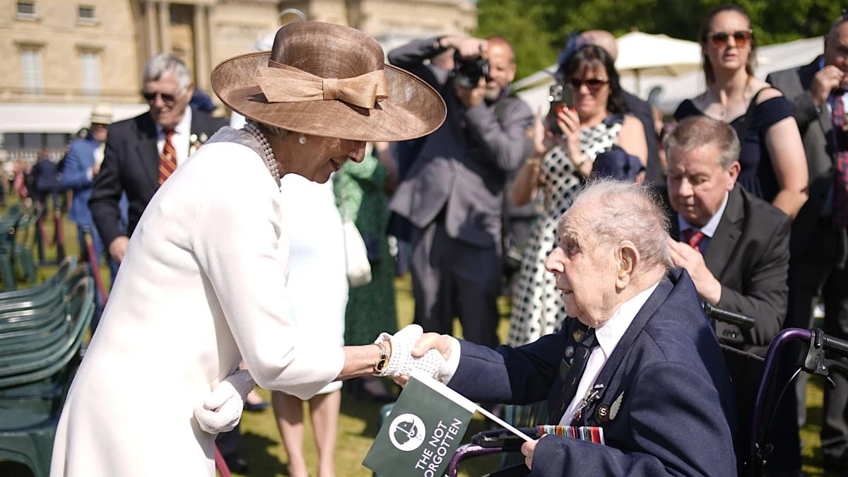 Veteran, 102, recalls war stories as he joins comrades at royal garden party