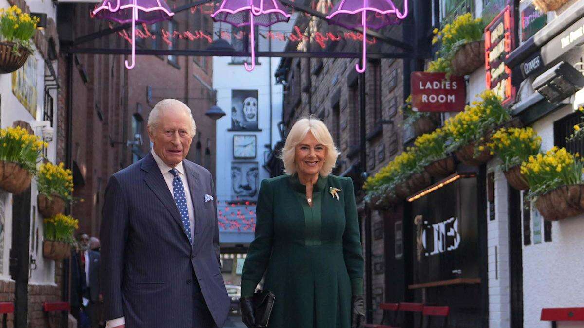 Charles and Camilla commence NI visit with sea shanties and acrobatics