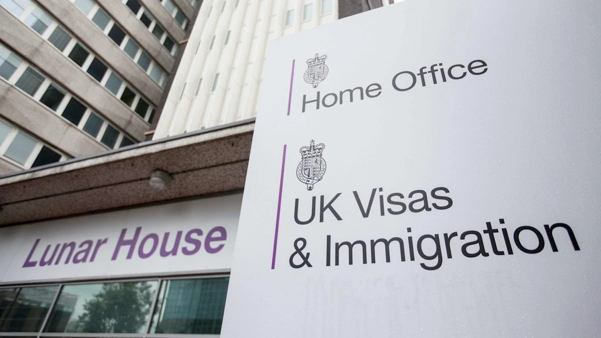 Number of foreign nationals arriving on work visas falls by nearly a half