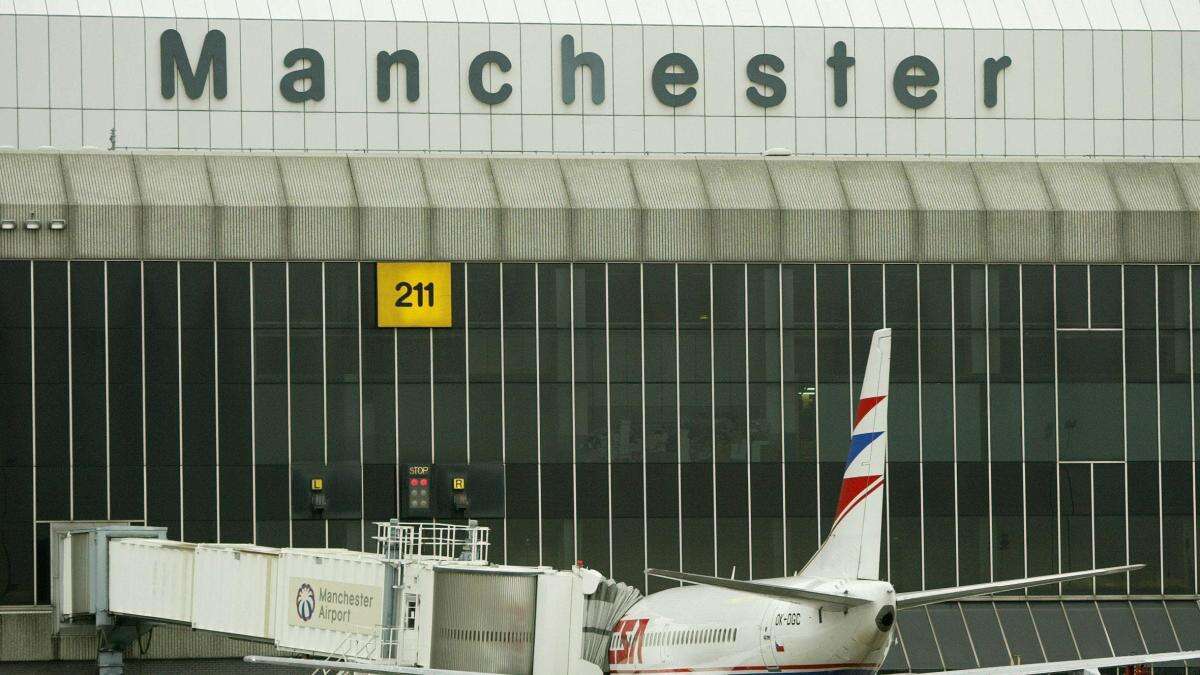 Two men charged with assaulting police after Manchester Airport incident