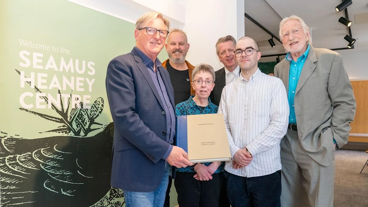 Adrian Dunbar gives rare art book to the Seamus Heaney Centre