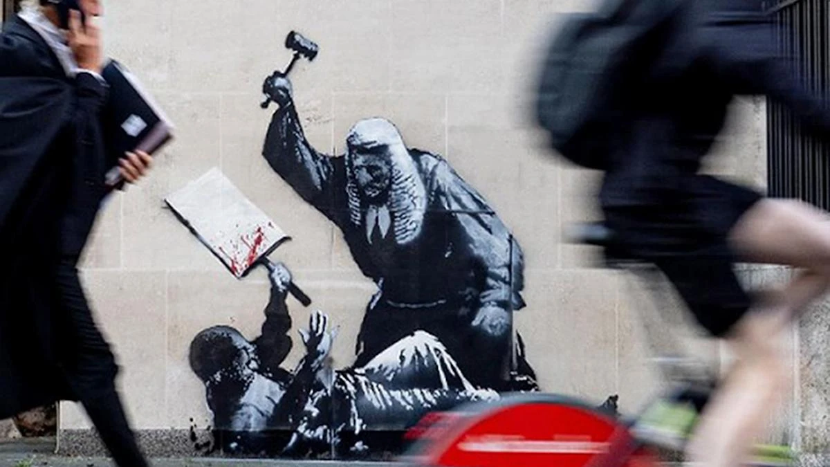Concealed Banksy artwork shows judge beating unarmed protester