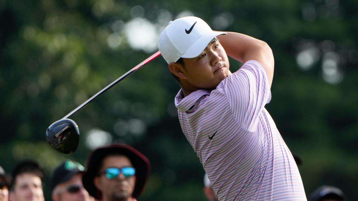 Tom Kim keeps lead as Shane Lowry and Robert MacIntyre shoot into contention