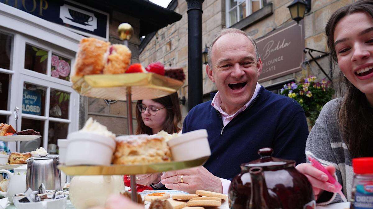 Ed Davey makes biscuits with young carers and says they deserve ‘better’ support